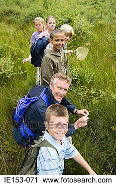 Stock Photography - teacher and pupils 
at nature reserve. 
fotosearch - search 
stock photos, 
pictures, images, 
and photo clipart