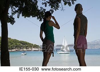 Stock Photography - friends stood 
in the shade. 
fotosearch - search 
stock photos, 
pictures, images, 
and photo clipart