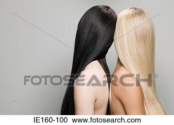 Stock Photography - two women back 
to back. fotosearch 
- search stock 
photos, pictures, 
images, and photo 
clipart