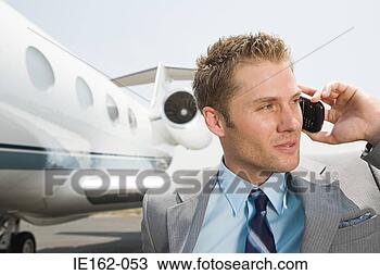 Stock Photo - businessman on 
cellphone. fotosearch 
- search stock 
photos, pictures, 
images, and photo 
clipart