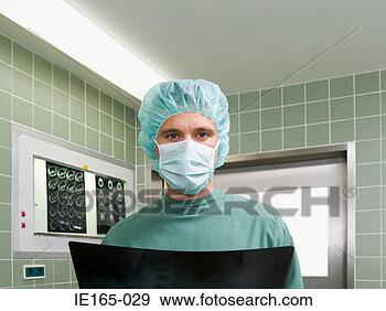 Stock Photograph - a surgeon holding 
an x ray. fotosearch 
- search stock 
photos, pictures, 
images, and photo 
clipart