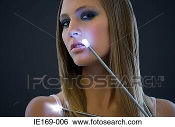 Stock Photo - a woman and a 
fibre optic light. 
fotosearch - search 
stock photos, 
pictures, images, 
and photo clipart