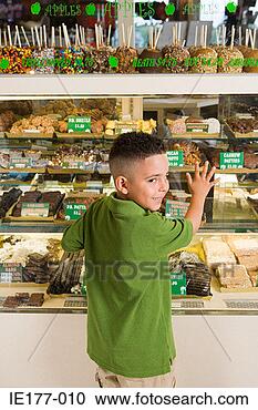 Stock Photography - boy by cake shop. 
fotosearch - search 
stock photos, 
pictures, images, 
and photo clipart