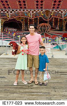 Stock Photo - father and children 
at amusement park. 
fotosearch - search 
stock photos, 
pictures, images, 
and photo clipart