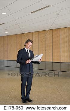 Stock Photography - a businessman 
reading newspaper. 
fotosearch - search 
stock photos, 
pictures, images, 
and photo clipart