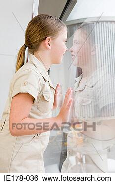 Stock Photo - a girl looking 
out of the window. 
fotosearch - search 
stock photos, 
pictures, images, 
and photo clipart