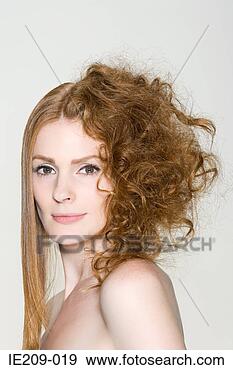 Stock Photograph - a woman with straight 
and curly hair. 
fotosearch - search 
stock photos, 
pictures, images, 
and photo clipart