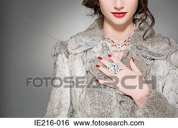 Stock Photo - woman wearing 
diamonds and a 
fur coat. fotosearch 
- search stock 
photos, pictures, 
images, and photo 
clipart