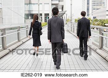 Stock Photograph - rear view of businesspeople 
walking. fotosearch 
- search stock 
photos, pictures, 
images, and photo 
clipart