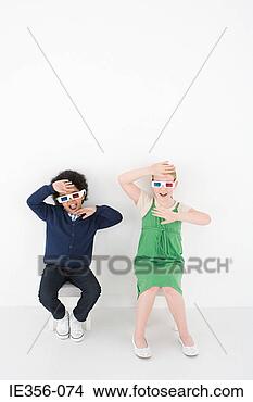 Stock Photo - boy and girl in 
3d glasses. fotosearch 
- search stock 
photos, pictures, 
images, and photo 
clipart
