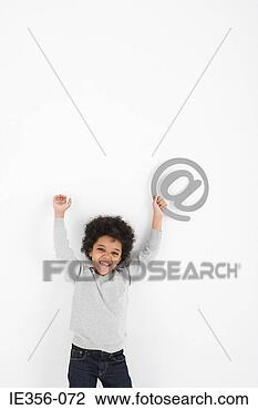 Stock Photo - boy holding an 
at symbol. fotosearch 
- search stock 
photos, pictures, 
images, and photo 
clipart