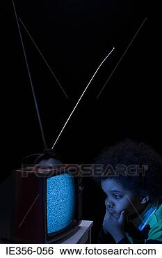 Stock Photo - boy looking at 
tv screen. fotosearch 
- search stock 
photos, pictures, 
images, and photo 
clipart