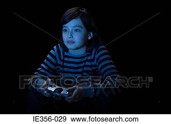 Stock Photograph - boy playing video 
game. fotosearch 
- search stock 
photos, pictures, 
images, and photo 
clipart