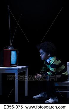 Stock Image - boy watching television. 
fotosearch - search 
stock photos, 
pictures, images, 
and photo clipart