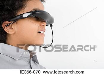 Stock Photography - boy wearing virtual 
reality headset. 
fotosearch - search 
stock photos, 
pictures, images, 
and photo clipart