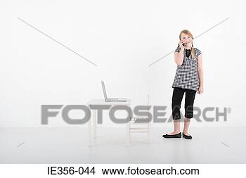 Stock Photo - girl with cellphone 
and laptop. fotosearch 
- search stock 
photos, pictures, 
images, and photo 
clipart