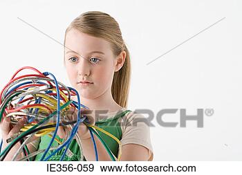 Stock Photograph - girl holding cables. 
fotosearch - search 
stock photos, 
pictures, images, 
and photo clipart