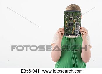 Stock Photography - girl holding circuit 
board. fotosearch 
- search stock 
photos, pictures, 
images, and photo 
clipart