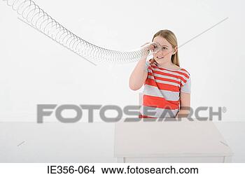 Stock Photo - girl with metal 
coil. fotosearch 
- search stock 
photos, pictures, 
images, and photo 
clipart