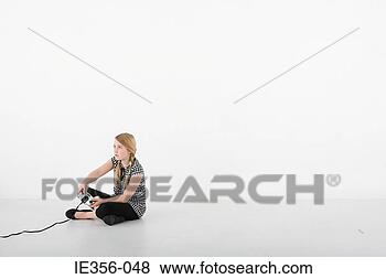 Stock Photo - girl playing video 
game. fotosearch 
- search stock 
photos, pictures, 
images, and photo 
clipart