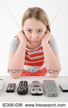 Stock Photo - girl with remote 
controls. fotosearch 
- search stock 
photos, pictures, 
images, and photo 
clipart