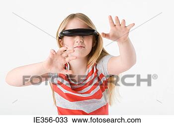Stock Photo - girl wearing virtual 
reality headset. 
fotosearch - search 
stock photos, 
pictures, images, 
and photo clipart
