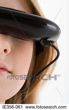 Stock Photography - girl wearing virtual 
reality headset. 
fotosearch - search 
stock photos, 
pictures, images, 
and photo clipart