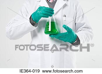 Stock Photograph - scientist holding 
flask. fotosearch 
- search stock 
photos, pictures, 
images, and photo 
clipart