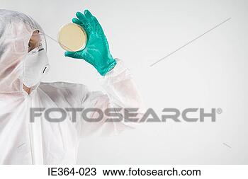 Stock Photo - scientist holding 
petri dish. fotosearch 
- search stock 
photos, pictures, 
images, and photo 
clipart