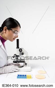 Stock Photography - scientist with 
microscope. fotosearch 
- search stock 
photos, pictures, 
images, and photo 
clipart