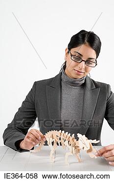 Stock Photo - scientist with 
model dinosaur. 
fotosearch - search 
stock photos, 
pictures, images, 
and photo clipart
