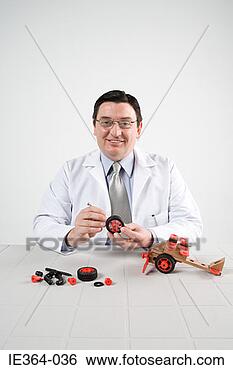 Stock Photo - scientist with 
model helicopter. 
fotosearch - search 
stock photos, 
pictures, images, 
and photo clipart