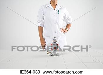 Stock Photograph - scientist and 
robot. fotosearch 
- search stock 
photos, pictures, 
images, and photo 
clipart