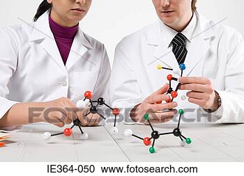 Stock Photography - scientists with 
molecule models. 
fotosearch - search 
stock photos, 
pictures, images, 
and photo clipart