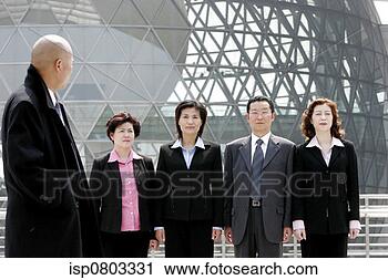 Stock Photography - a bald man watching 
his employees 
standing at attention. 
fotosearch - search 
stock photos, 
pictures, images, 
and photo clipart
