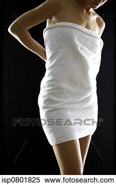 Stock Image - shoulder down 
shot of a woman 
with a towel wrapped 
around her body. 
fotosearch - search 
stock photos, 
pictures, images, 
and photo clipart