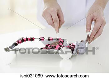 Stock Photograph - doctor counting 
pills on pharmaceutical 
tray. fotosearch 
- search stock 
photos, pictures, 
images, and photo 
clipart