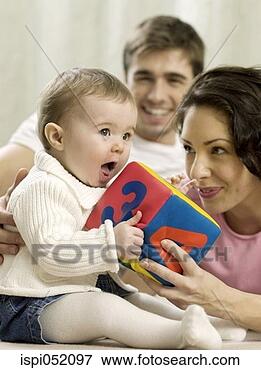 Picture - parents playing 
with baby girl. 
fotosearch - search 
stock photos, 
pictures, images, 
and photo clipart