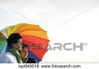 Stock Photo - two men with an 
umbrella. fotosearch 
- search stock 
photos, pictures, 
images, and photo 
clipart
