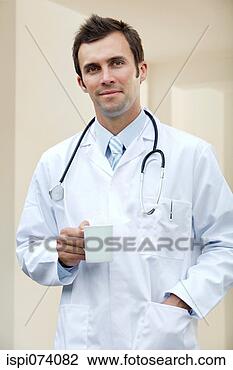 Stock Photo - male doctor with 
a cup of coffee. 
fotosearch - search 
stock photos, 
pictures, images, 
and photo clipart