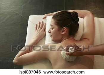 Stock Photo - woman enjoying 
a back massage. 
fotosearch - search 
stock photos, 
pictures, images, 
and photo clipart