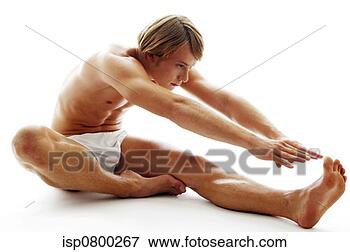 Picture - a shirtless man 
in white underwear 
stretching his 
hands to touch 
his. fotosearch 
- search stock 
photos, pictures, 
images, and photo 
clipart