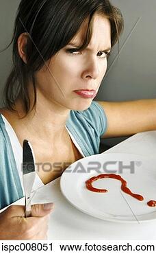 Stock Photography - woman with angry 
face sitting in 
front of a question 
marked plate. 
fotosearch - search 
stock photos, 
pictures, images, 
and photo clipart