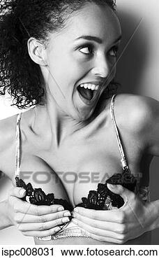 Stock Photography - woman pushing 
up her breasts. 
fotosearch - search 
stock photos, 
pictures, images, 
and photo clipart