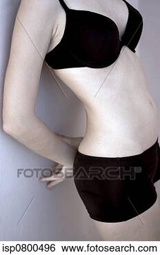 Stock Photo - shoulder down 
shot of a woman 
in black bra and 
panties leaning. 
fotosearch - search 
stock photos, 
pictures, images, 
and photo clipart