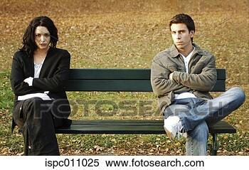 Stock Image - couple sitting 
on different ends 
of a bench. fotosearch 
- search stock 
photos, pictures, 
images, and photo 
clipart