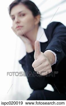 Stock Photograph - businesswoman 
showing thumb 
up. fotosearch 
- search stock 
photos, pictures, 
images, and photo 
clipart