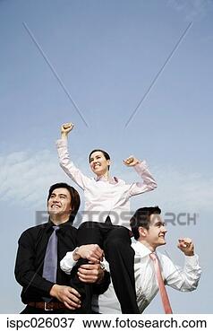 Picture - businessmen lifting 
up the female 
winner. fotosearch 
- search stock 
photos, pictures, 
images, and photo 
clipart