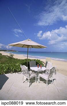 Stock Photograph - refreshment on 
the patio by the 
beach, meads bay, 
caribbean. fotosearch 
- search stock 
photos, pictures, 
images, and photo 
clipart