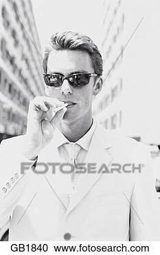 Stock Photography - man in white suit 
and sunglasses, 
smoking cigarette, 
/ndubai, uae/nb&w. 
fotosearch - search 
stock photos, 
pictures, images, 
and photo clipart